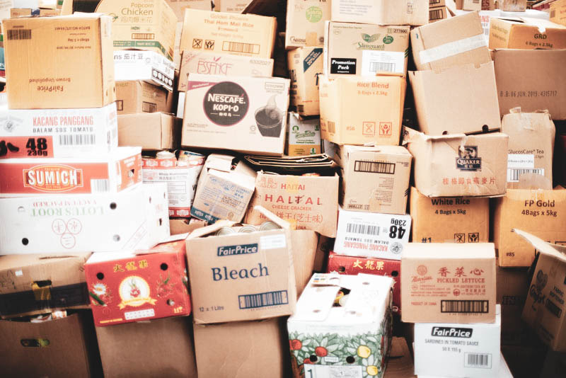 A chaotic pile of packages stacked high from all over the world.